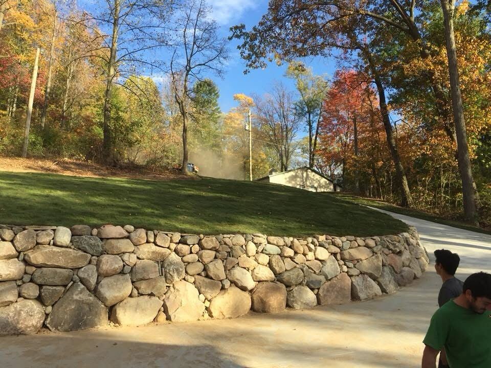 Graded yard with a finished stone retaining wall